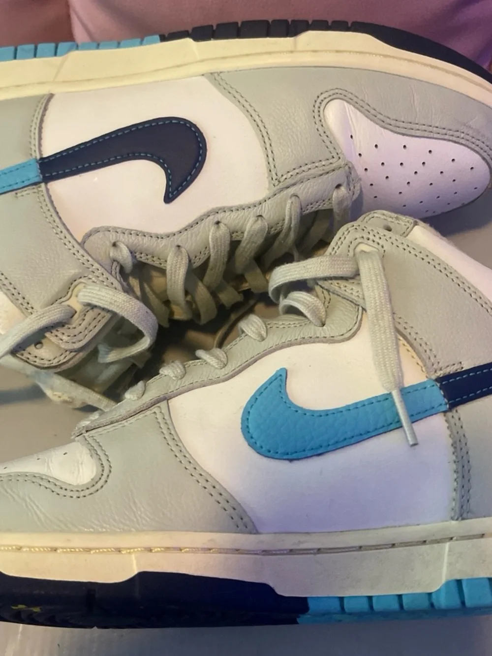 Nike Kids White Sneakers with Light Blue Swoosh and Navy Soles